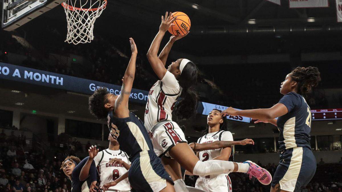 University of South Carolina’s Bree Hall (23) shoots as Charleston Southern’s Madison Adamson (20) defends during the first half of action in the Colonial Life Arena on Thursday, Dec.19, 2024.