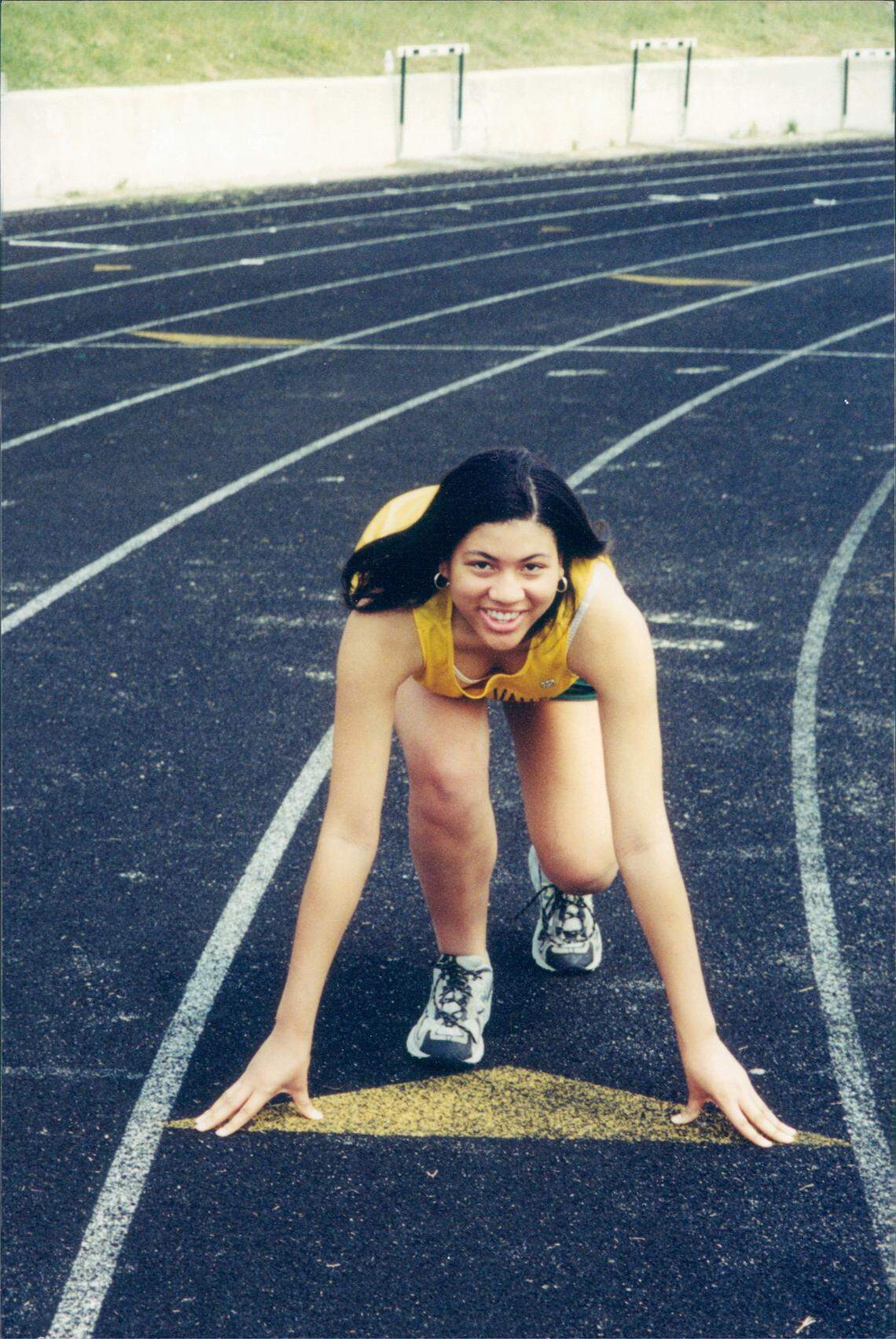 Tracy Oliver poses for a picture in her Spring Valley High School track uniform.