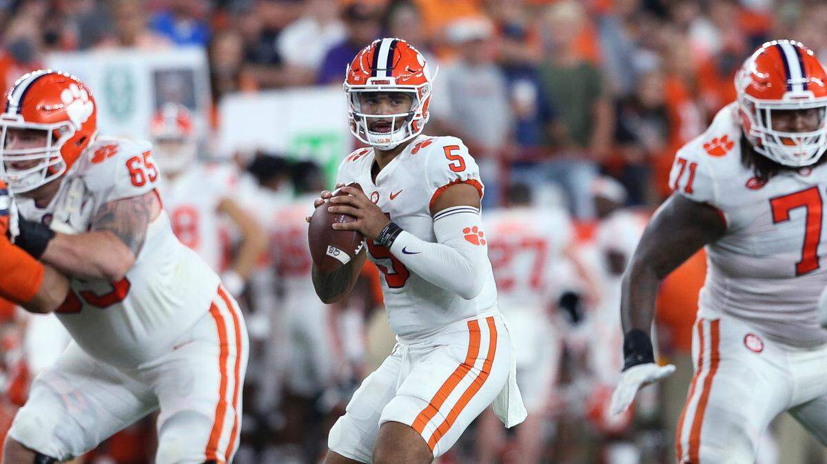 Clemson quarterback D.J. Uiagalelei (5) looks for a receiver during the fourth quarter of the team’s NCAA football game against Syracuse in Syracuse, N.Y., Friday, Oct. 15, 2021. (AP Photo/Joshua Bessex)