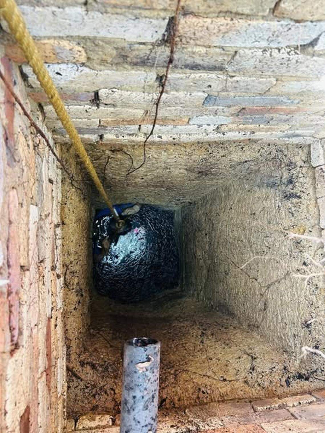 Rescuers worked to aid a woman who was trapped in a well.