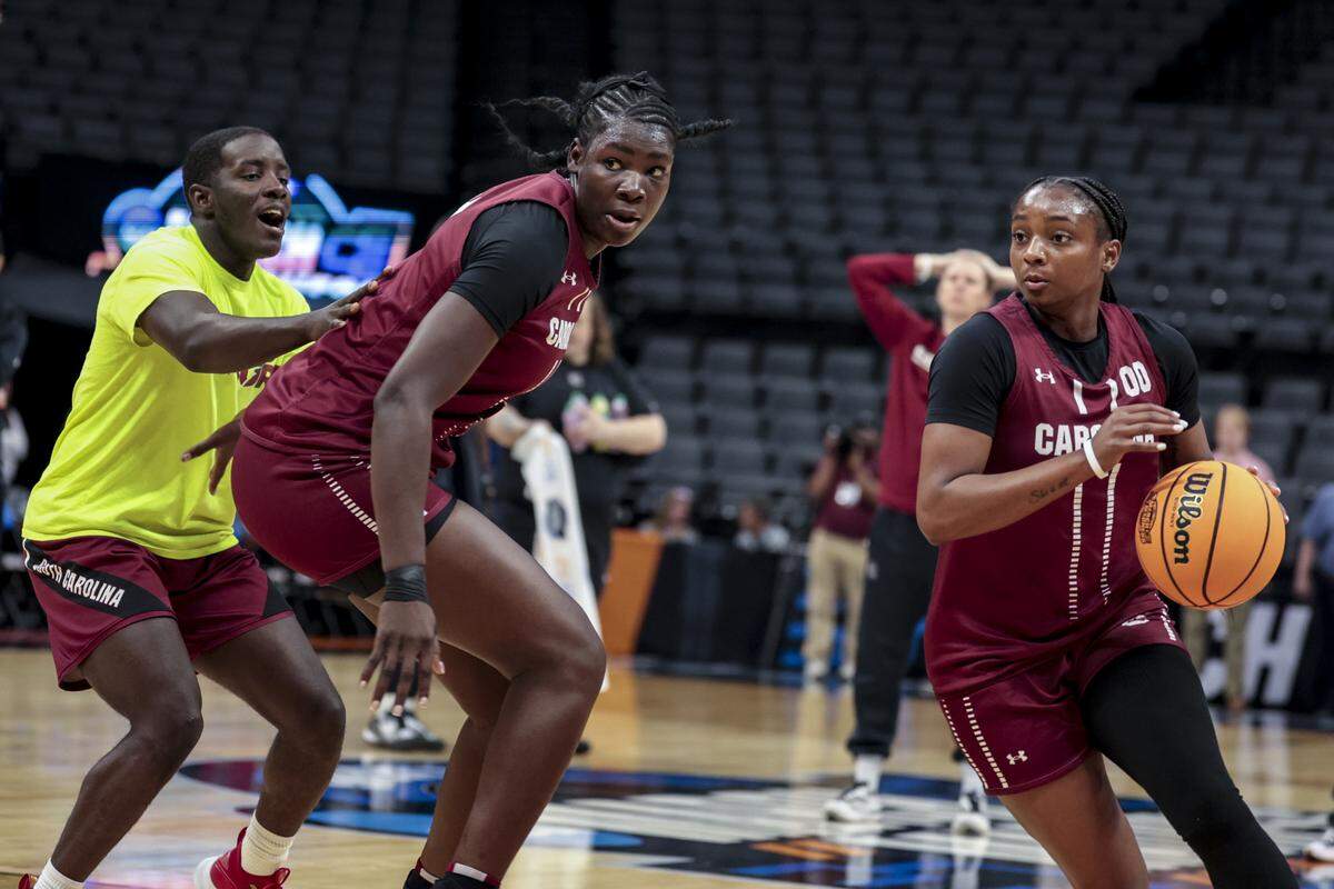 South Carolina's Ta'Niya Latson (00) and Madina Okot (11) run drills on Friday, March 27, 2026, a day before their NCAA Tournament Sweet 16 game against Oklahoma, in the Sacramento Regional 4, at the Golden 1 Center in Sacramento, California.