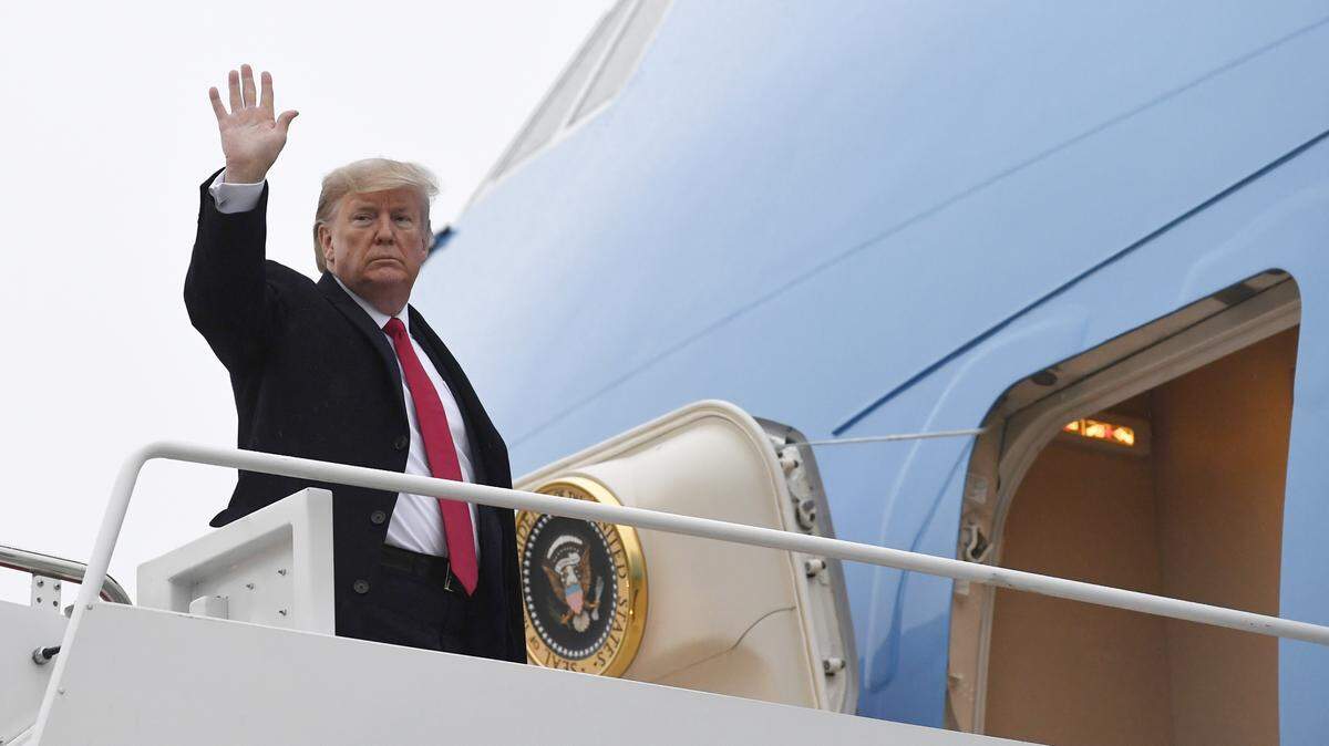 President Donald Trump waves from the top of the steps of Air Force One at Andrews Air Force Base in Md., Friday, Jan. 31, 2020. (AP Photo/Susan Walsh)