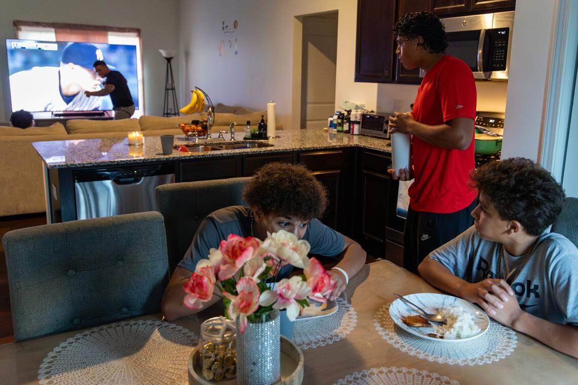 Rafael Soto Sr., who for years has coached shortstops in the U.S. and Dominican Republic, often uses televised games to continue giving lessons, as he does here.