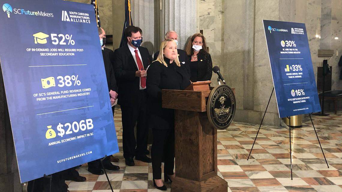 Sara Hazzard, center, president and CEO of the South Carolina Manufacturers Alliance, speaks at the S.C. State House on Tuesday, April 20, 2021, after a new manufacturing economic impact study.