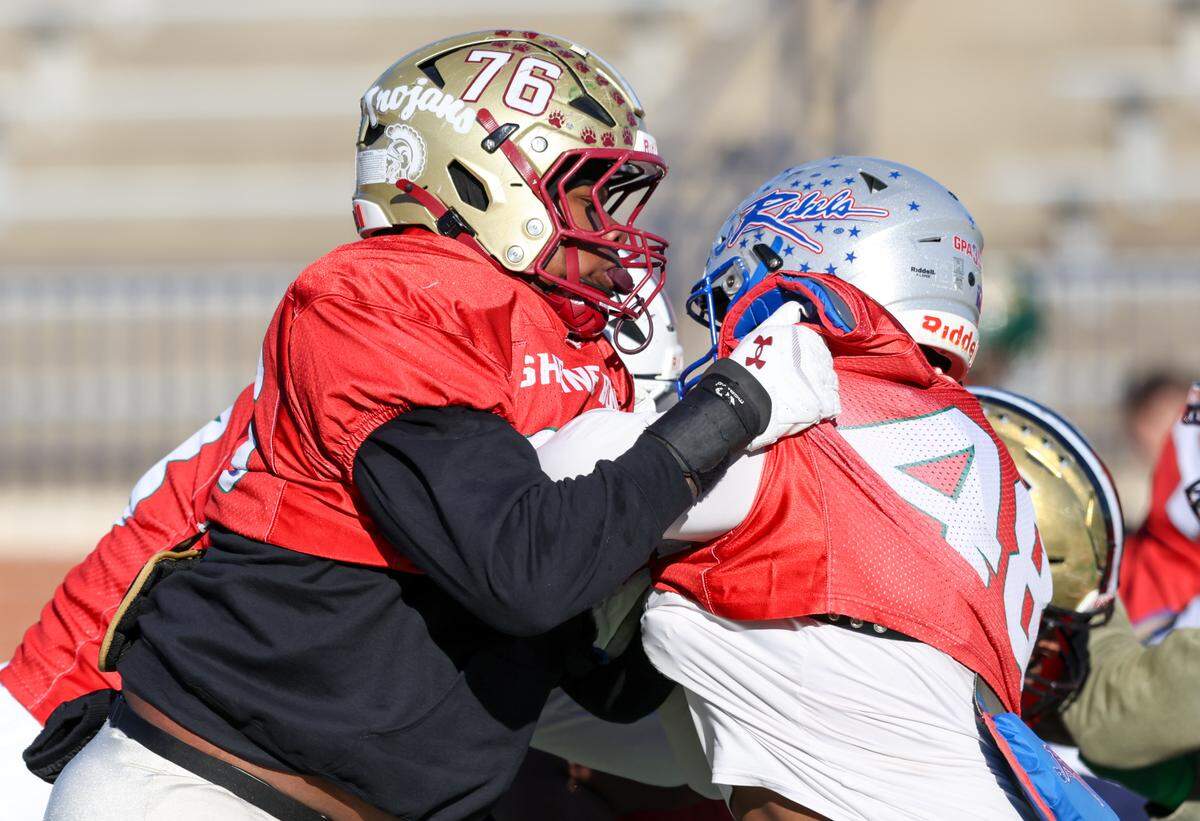 Zyon Guiles (76) Carvers Bay High School and Justice Hopkins (48) are seen at Spartanburg High School in Spartanburg on Dec. 15. 