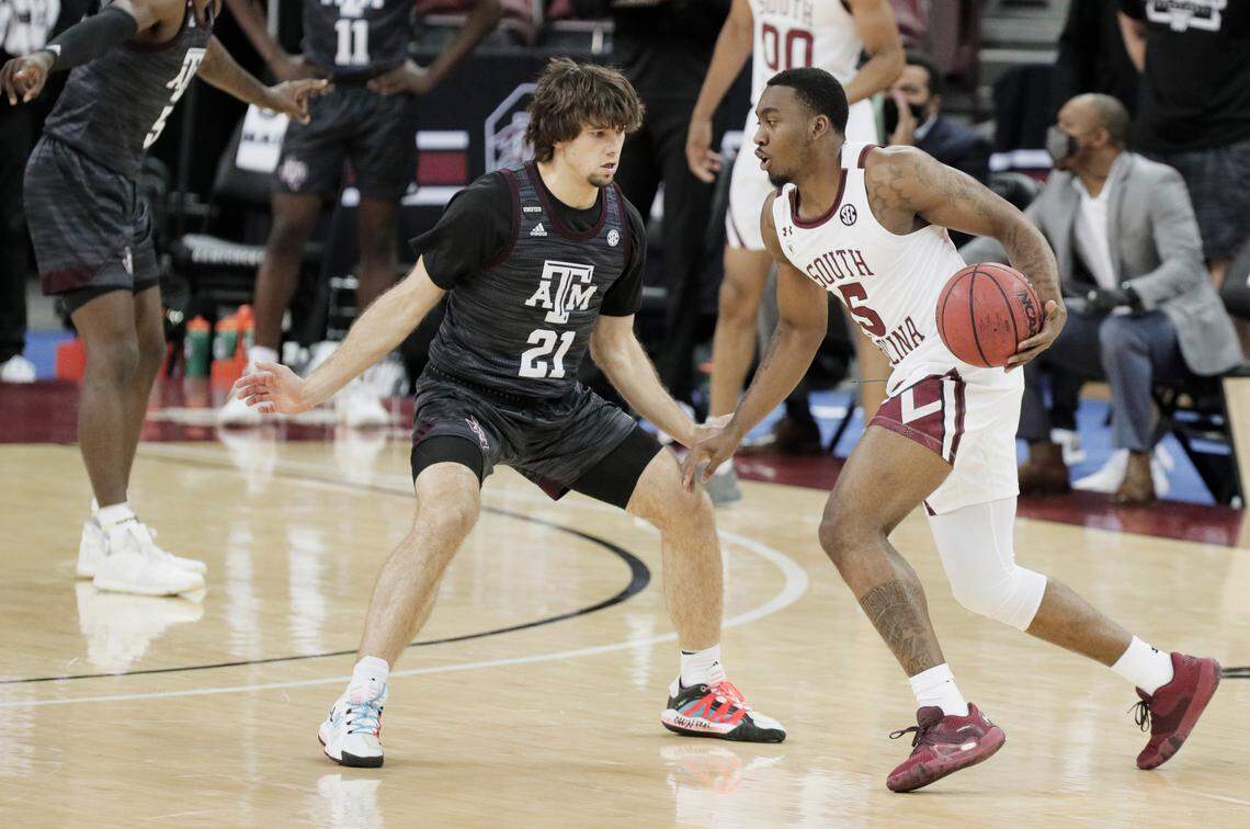 Texas A&M Aggies guard Zach Walker (21) guards South Carolina Gamecocks guard Jermaine Couisnard (5) at Colonial Life Arena on Wednesday, January 6, 2021.
