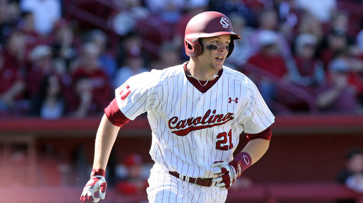 Grayson Greiner singles during the first game against Brown on Saturday, March 8, 2014, at Carolina Stadium.