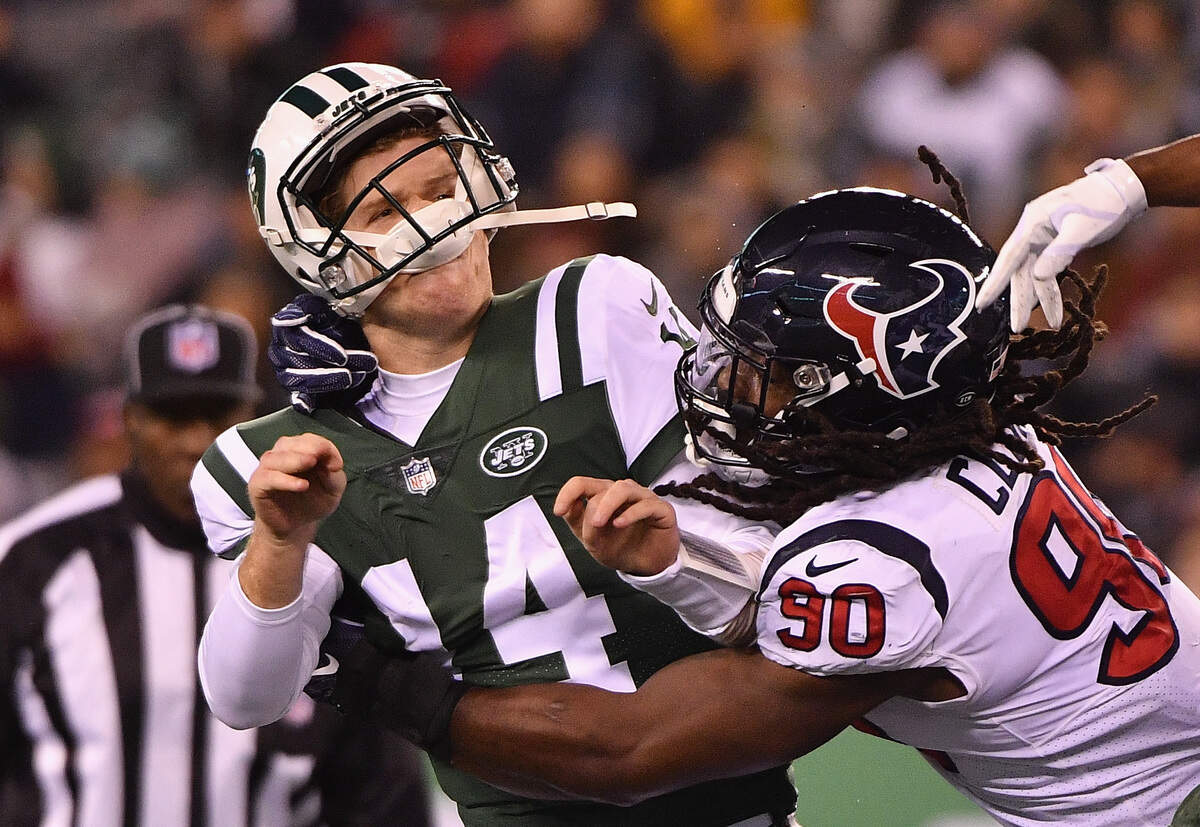 Former USC pass rusher Jadeveon Clowney (90) sacking New York Jets quarterback Sam Darnold (14) in a 2018 game while with the Houston Texans