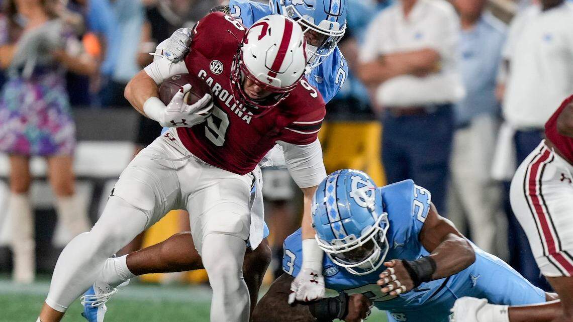 Sep 2, 2023; Charlotte, North Carolina, USA; South Carolina Gamecocks wide receiver Luke Doty (9) is tackled by North Carolina Tar Heels linebacker Power Echols (23) during the second quarter at Bank of America Stadium. Mandatory Credit: Jim Dedmon-USA TODAY Sports