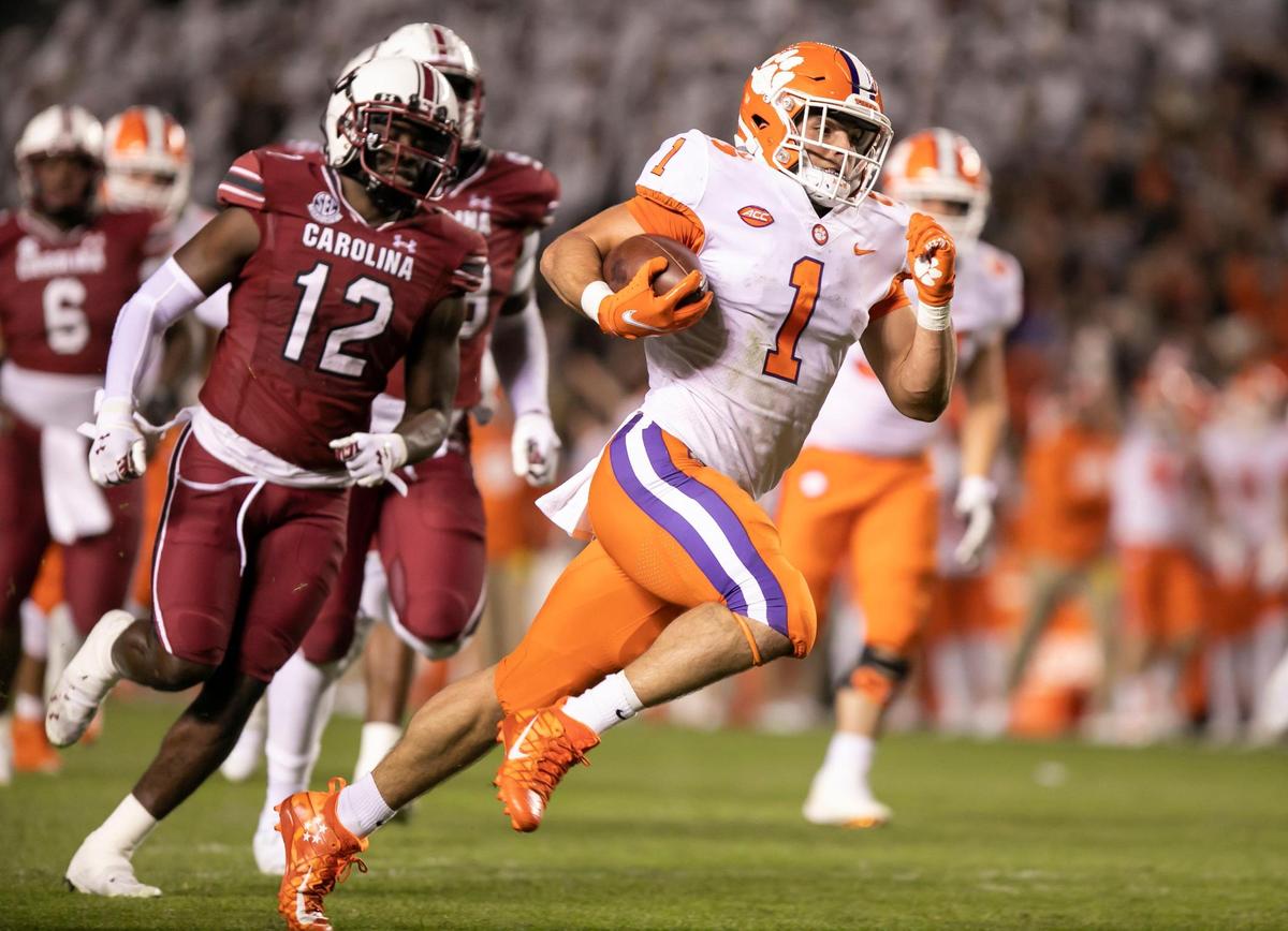 Will Shipley of Clemson carries the ball in for a touchdown as Jaylan Foster gives chase during the Gamecocks’ game against Clemson at Williams-Brice Stadium on Saturday, November 27, 2021.