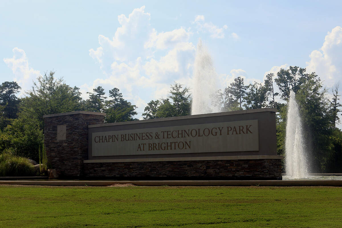 Fountains run behind the sign at the vacant Chapin Business & Technology Park at Brighton. July 9, 2024