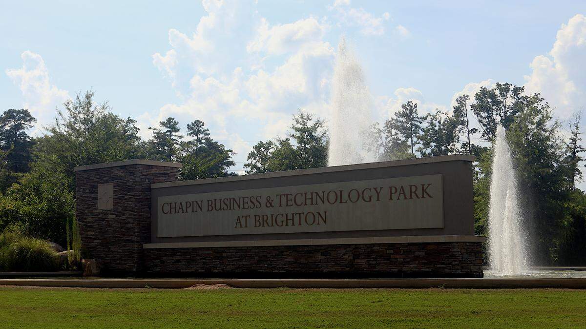 Fountains run behind the sign at the vacant Chapin Business & Technology Park at Brighton. July 9, 2024