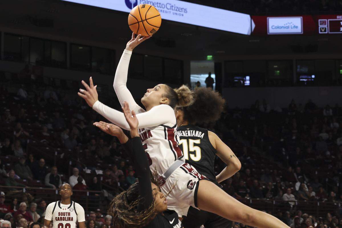 South Carolina's Tessa Johnson (5) shoots as Vanderbilt's Mikayla Blakes (1) and Vanderbilt's Ndjakalenga Mwenentanda (15) pressure during the first half of action of their women's basketball game against Vanderbilt at Colonial Life Arena on Sunday, Jan. 25, 2026.