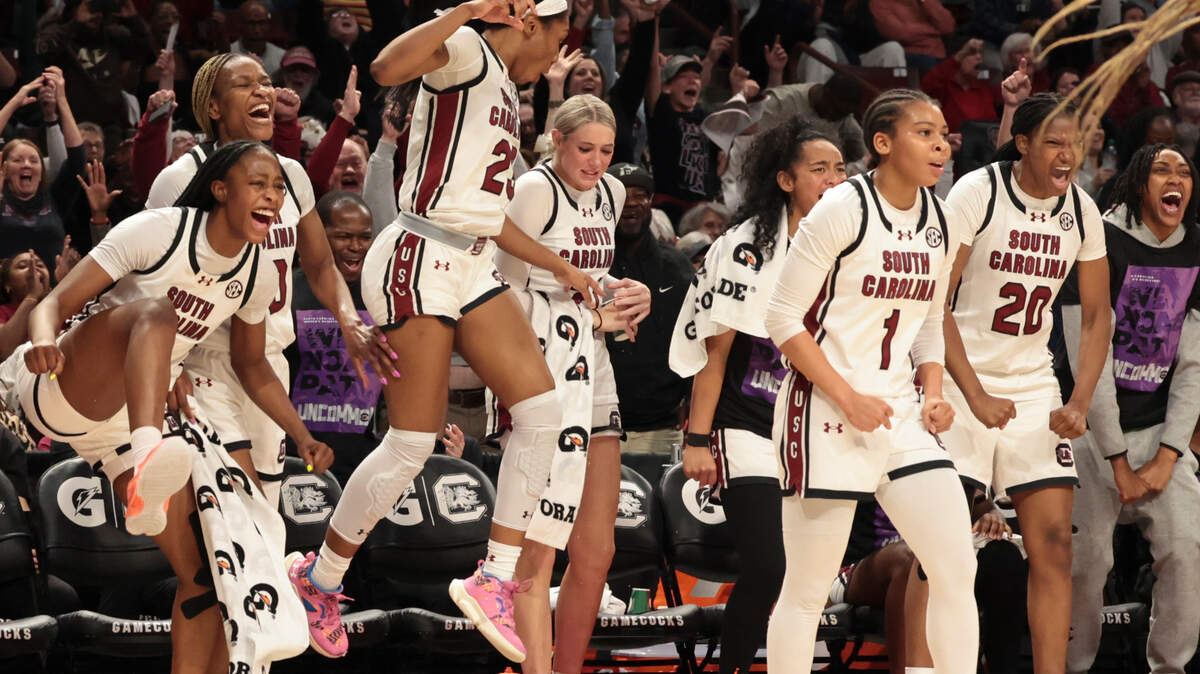 The Gamecock bench celebrates a shot by Adhel Tac (15) during the first half of action in the Colonial Life Arena on Sunday, Jan. 19, 2025.