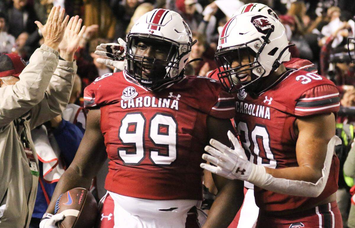 South Carolina’s linebacker Damani Staley (30) congratulates South Carolina’s defensive lineman Jabari Ellis (99) who scored on a fumble return as the Gamecocks take on Florida on Saturday, Nov, 6, 2021 at Williams-Brice Stadium.