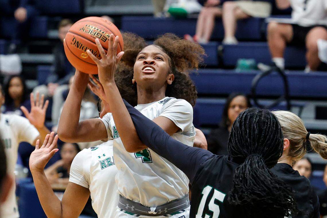 Heathwood’s Camillea Gore (4) looks to shoot as Northwood’s Alayah Birch (15) defends during the first half of action in the SC Independent Schools Association 4A championship at the Sumter Civic Center on Friday, Feb. 23, 2024