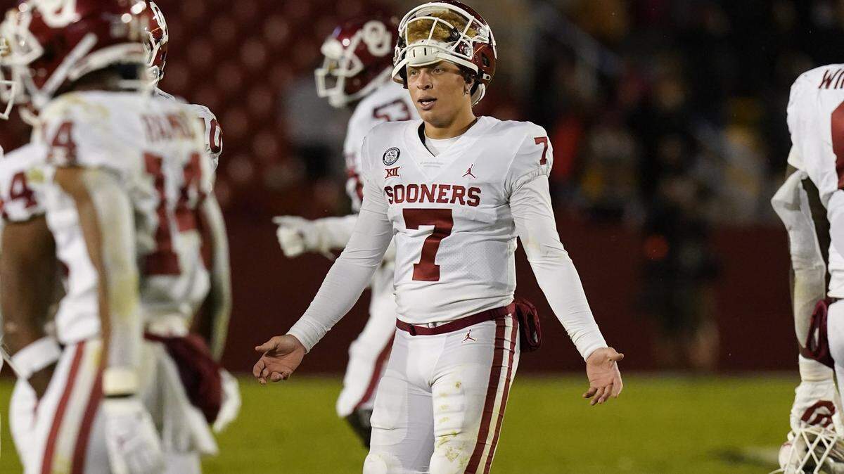 Oklahoma quarterback Spencer Rattler (7) reacts after throwing an interception during the second half an NCAA college football game against Iowa State, Saturday, Oct. 3, 2020, in Ames, Iowa. Iowa State won 37-30. (AP Photo/Charlie Neibergall)