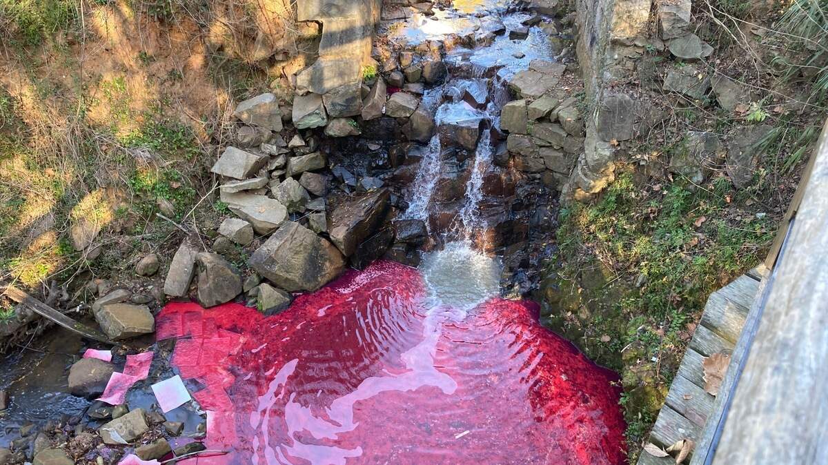 Diesel fuel turned a creek red in downtown Columbia in early December 2021. This is what the tributary of the Congaree River looked like after the diesel spill. The tributary is just below the Gervais Street bridge.