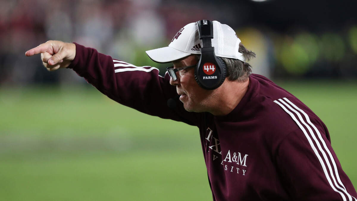 Texas A&M coach Jimbo Fisher gives instructions to the offense during Saturday’s game against South Carolina at Williams-Brice Stadium.
