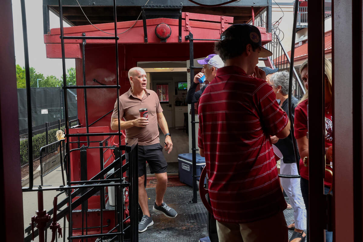 People pass between the Cockabooses before the USC game against LSU on Saturday, Sept. 14, 2024.