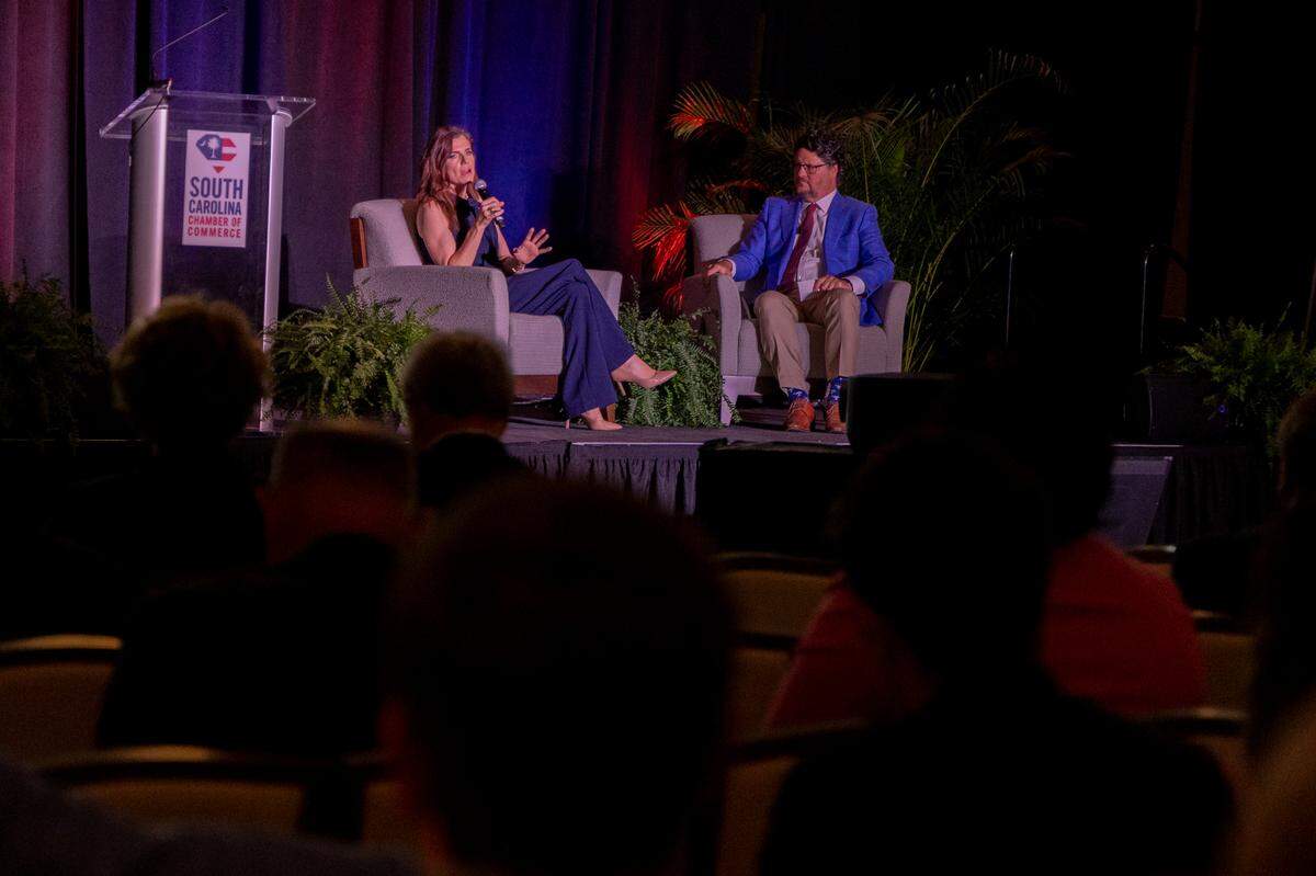 U.S. Rep. Nancy Mace, a Republican who represents the Lowcountry congressional district including Charleston, speaks with Gary Simrill during the South Carolina Chamber of Commerce Washington Night on Wednesday, Aug. 28, 2024. The event, at the Pastides Alumni Center, featured speakers from the South Carolina congressional delegation.