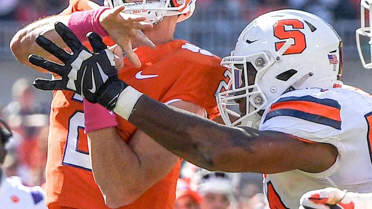 Syracuse defensive lineman Jatius Geer (54) pressures Clemson quarterback Cade Klubnik (2) during the fourth quarter at Memorial Stadium in Clemson, South Carolina Saturday, October 22, 2022. Geer, is a former Belton-Honea Path High standout.