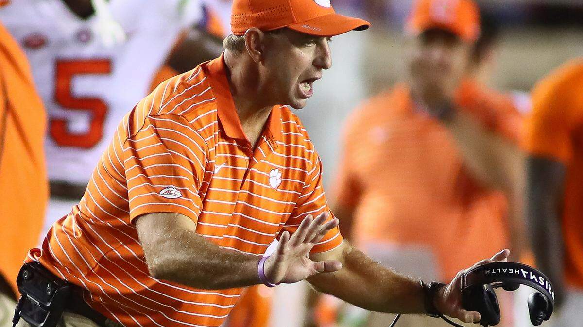 Clemson head coach Dabo Swinney tries to calm players during the third quarter of the team’s NCAA college football game against Florida State on Saturday, Oct. 15, 2022, in Tallahassee, Fla. Clemson won 34-28. (AP Photo/Phil Sears)
