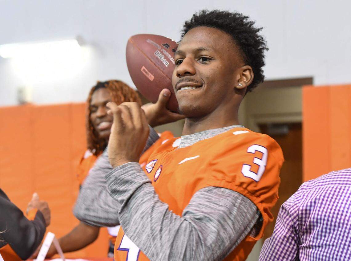 Clemson receiver Marquise Henderson (3) tosses a ball to a child who came with his family to the Clemson Club football National Signing Day wrap up presented by Clemson Seneca Chick-Fil-A at the Poe Indoor Practice Facility at Clemson University in Clemson, S.C. Feb 5, 2025.