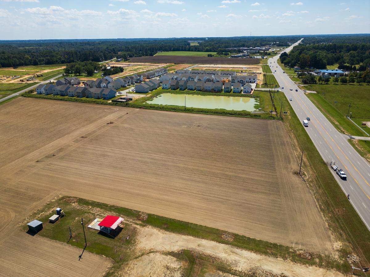 New housing, a businesses and even more housing under construction in Gilbert, South Carolina on Friday, August 29, 2025.