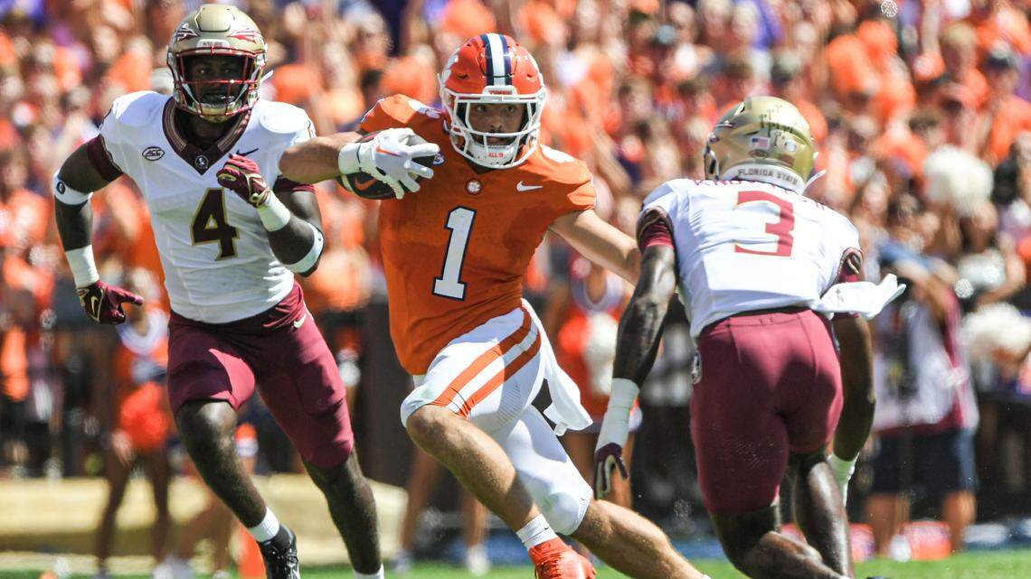 Sep 23, 2023; Clemson, South Carolina, USA; Clemson Tigers running back Will Shipley (1) runs against Florida State Seminoles defensive back Kevin Knowles II (3) during the first quarter at Memorial Stadium. Mandatory Credit: Ken Ruinard-USA TODAY Sports