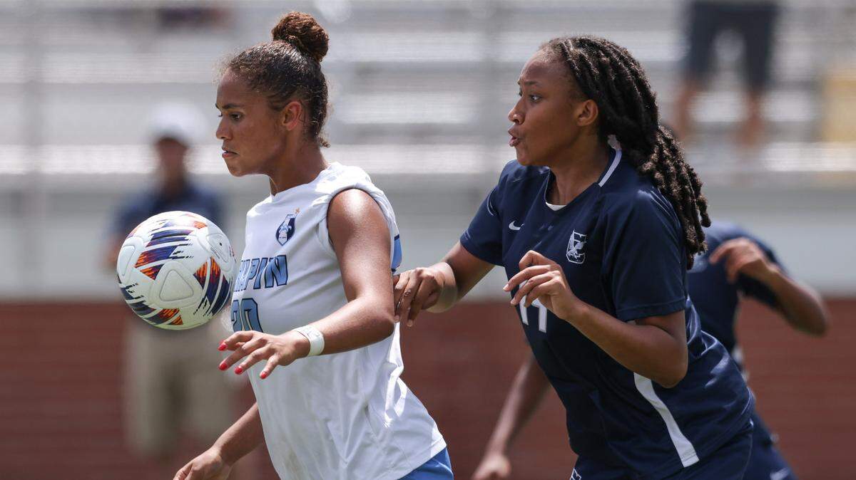 Grace Benson (20) of Chapin is defended by Olivia Lewter (19) of Clover during the second half of the SCHSL Class 5A Girls Soccer State Final at Memorial Stadium in Columbia on Friday, May 10, 2024.