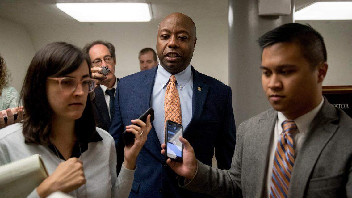 Sen. Tim Scott, R-S.C., speaks to reporters as he arrives at the Capitol.