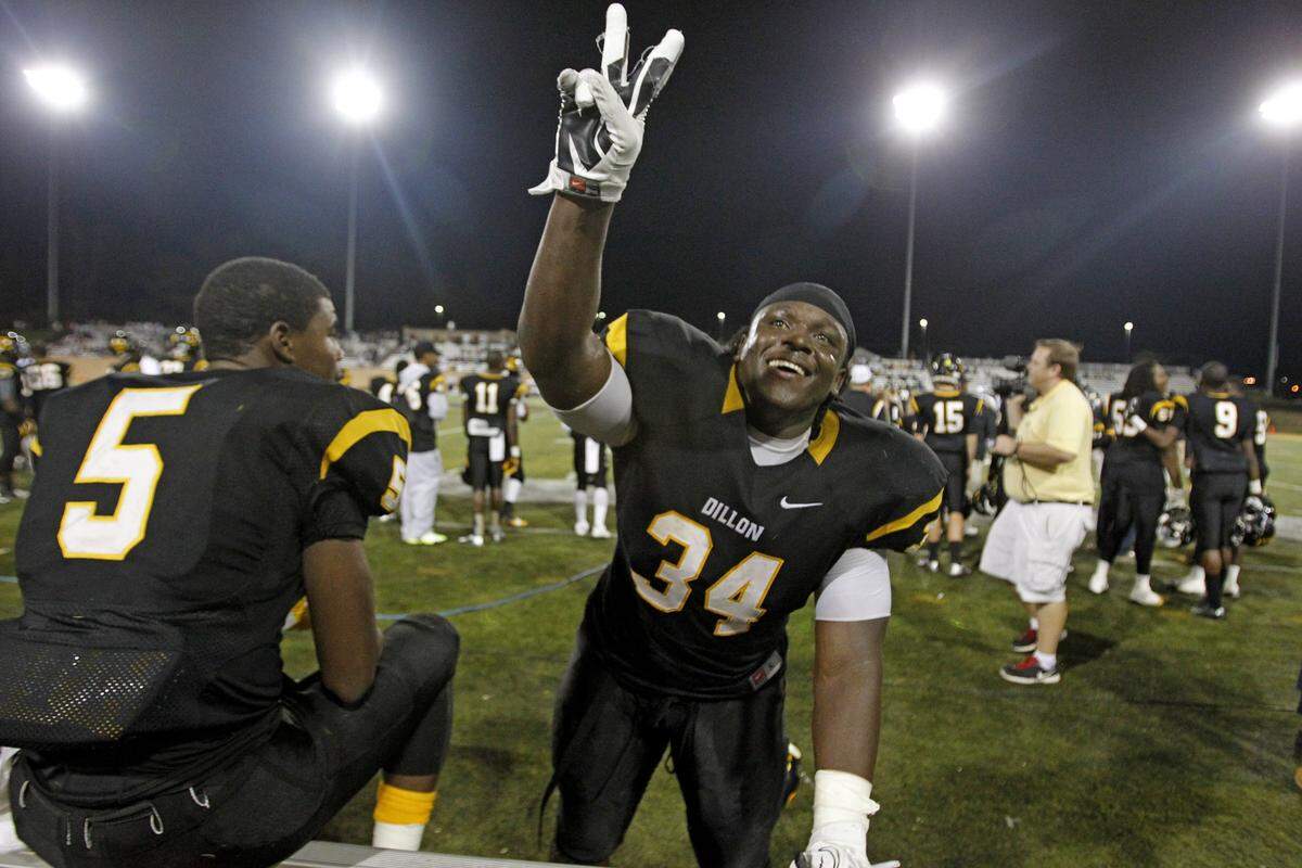 From December 2013: Dillon’s Joe Blue celebrates the team’s win over Fairfield Central for the Class 2A, Division I state championship at Charlie W. Johnson Stadium in Columbia, SC.