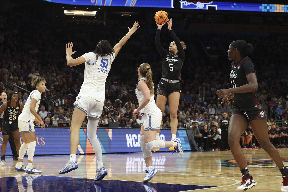 South Carolina's Tessa Johnson (5) shoots as UCLA’s Lauren Betts (51) pressures during the first half of action of their women's basketball game for the NCAA national championship against UCLA at Mortgage Matchup Center in Phoenix on Sunday, April 5,2026.