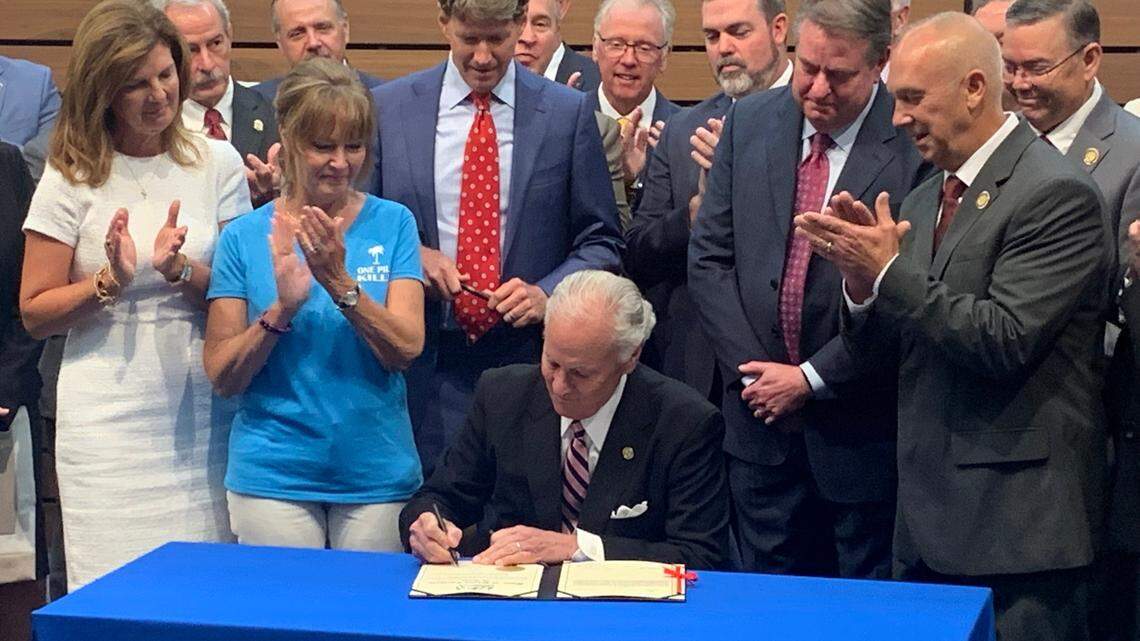 South Carolina Gov. Henry McMaster signs a law that orders prison time for possessing and trafficking fentanyl on Tuesday, Aug. 1, 2023 at the State Law Enforcement Division lab.