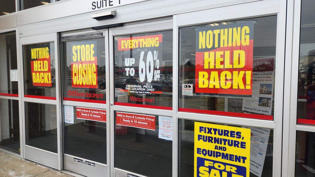 Signs on the doors of the Office Depot at 10050 Two Notch Road in northeast Columbia indicate the store is closing.