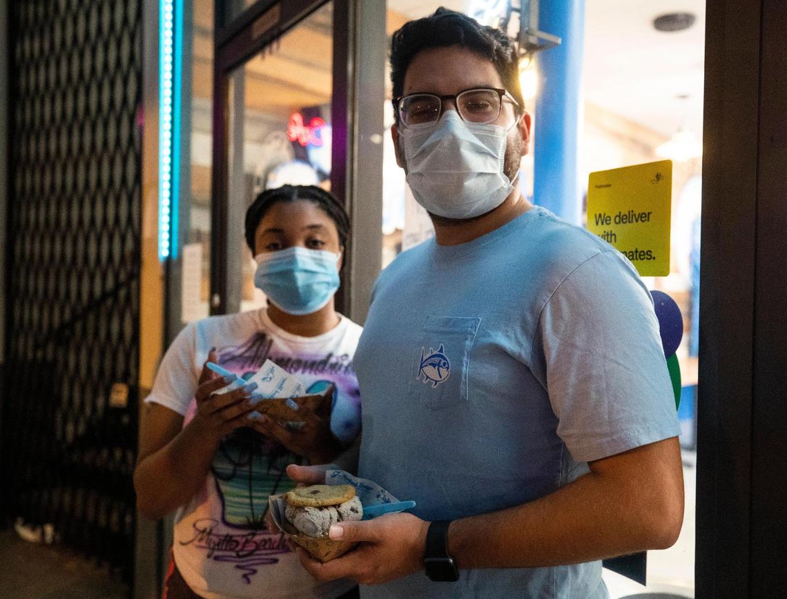 Ahmondria Davis and Ronaldo Martinez pose for a portrait with ice cream sandwiches in Five Points on Friday, June 26, 2020. The students at USC-Upstate were glad to wear masks in public.