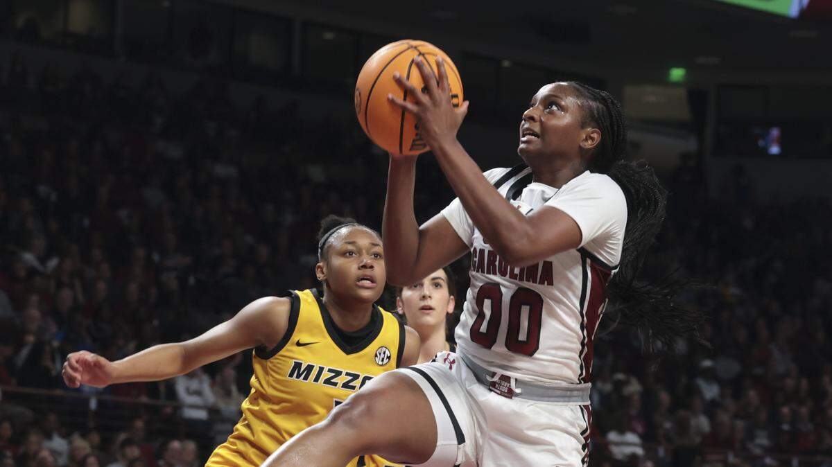 South Carolina's Ta'Niya Latson (00) shoots as Missouri's Shannon Dowell (1) pressures during the first half of action of their women's basketball game against Missouri at Colonial Life Arena on Thursday, Feb. 26, 2026.