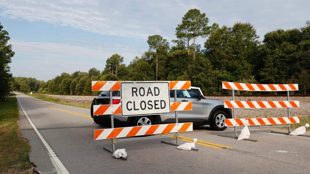 A police barrier closes a road in Lexington County after a Sept. 6, 2023, incident in which a woman was killed and a deputy was shot. The suspect in the case also was killed.