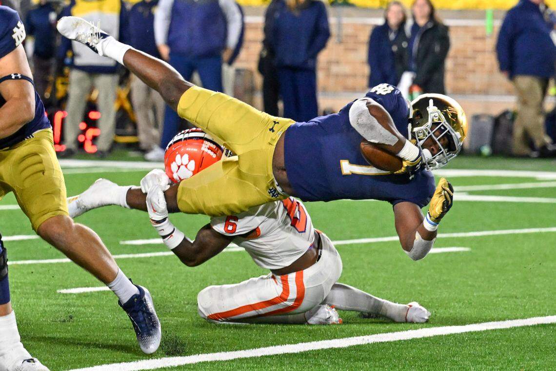 Nov 5, 2022; South Bend, Indiana, USA; Notre Dame Fighting Irish running back Audric Estime (7) scores a touchdown against the Clemson Tigers in the fourth quarter at Notre Dame Stadium. Mandatory Credit: Matt Cashore-USA TODAY Sports