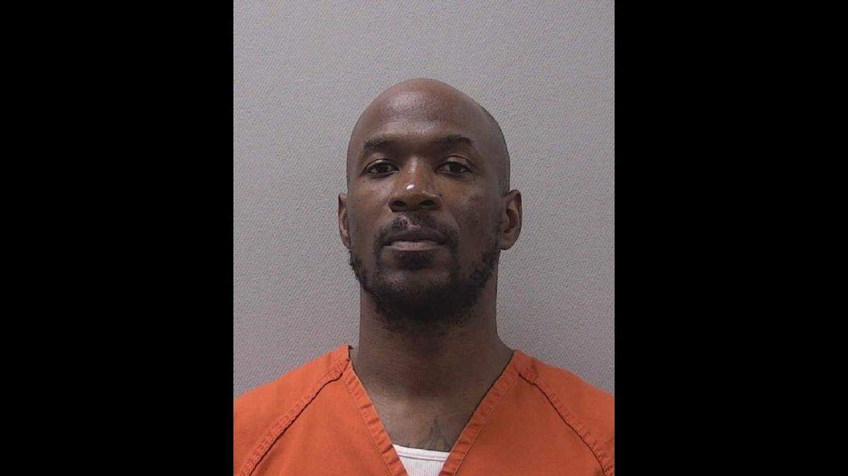 Eugene Christopher Washington is charged with six counts of larceny from a motor vehicle and one count of identity fraud, according to arrest warrants.