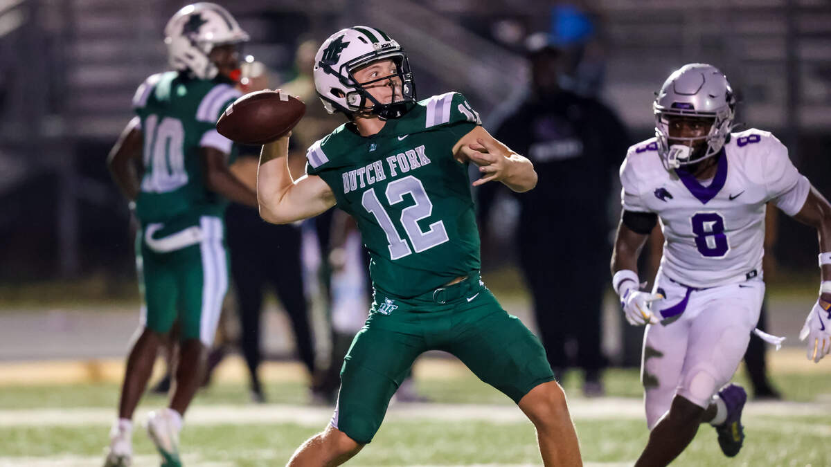 Dutch Fork Silver Foxes quarterback Jaxon Knotts (12) makes a touchdown pass on a trick play against the Ridge View Blazers during their game at Dutch Fork High School, Friday, 9/5/25.