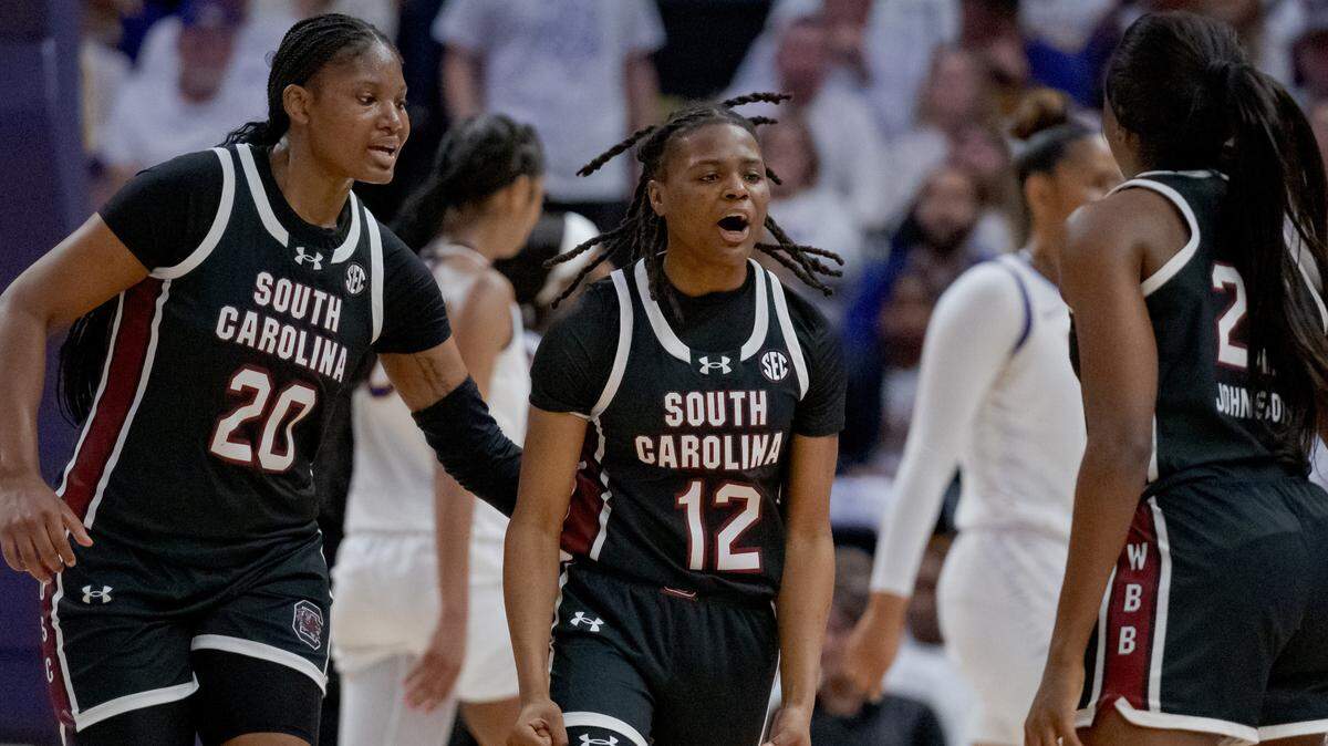 Jan 25, 2024; Baton Rouge, Louisiana, USA; South Carolina Gamecocks guard MiLaysia Fulwiley (12) celebrates a score with forward Sania Feagin (20) and guard Raven Johnson (25) against the LSU Lady Tigers during the first half at Pete Maravich Assembly Center.