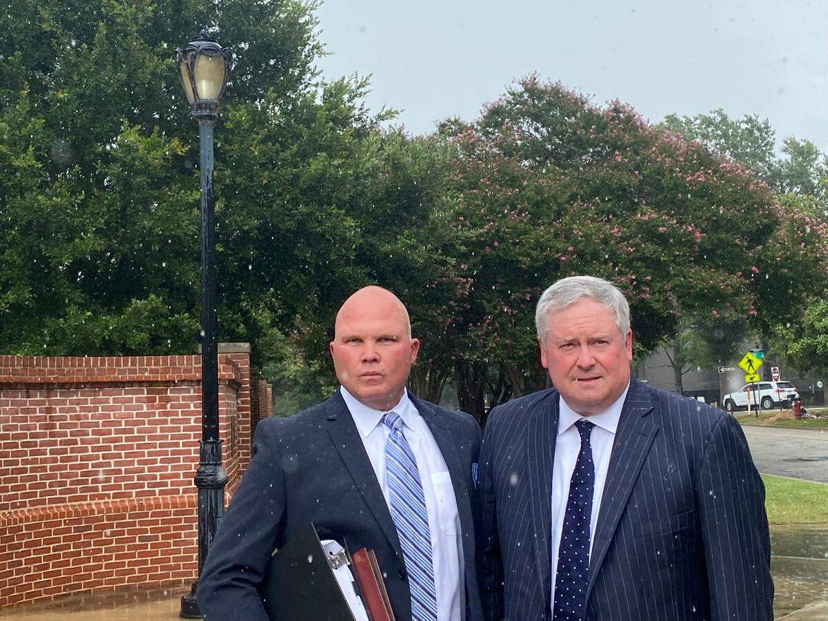 Ex-SEAL and marijuana smuggler James Dennis “JD” Smith stands with his lawyer Greg Harris (r) of Columbia after getting a prison sentence this week in Columbia.