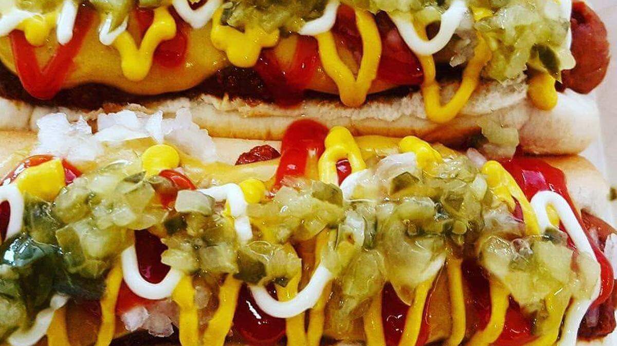 Hot dogs topped with chili, cheese, mustard, ketchup, pickle relish, onions and mayo are the order of the day.