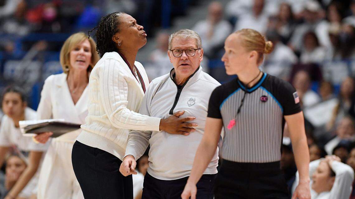 UConn head coach Geno Auriemma is held back by assistant coach Jamelle Elliott in the second half of an NCAA college basketball game against South Carolina, Sunday, Feb. 5, 2023, in Hartford, Conn. (AP Photo/Jessica Hill)
