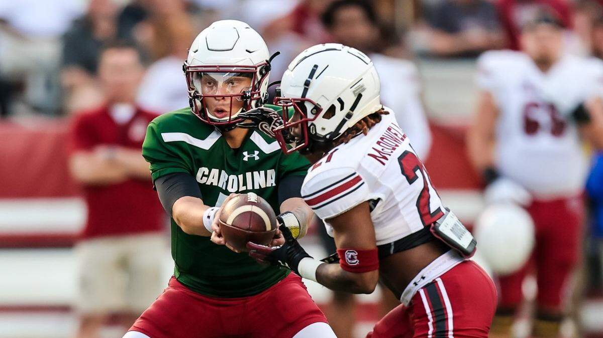 South Carolina Gamecocks quarterback Spencer Rattler hands off to South Carolina Gamecocks running back Juju McDowell (21) during the 2022 South Carolina Spring Game at Williams-Brice Stadium in Columbia, SC, April 16th, 2022.