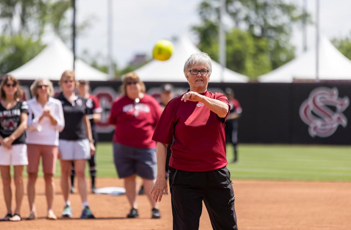 Retired softball Coach Joyce Compton throws out the first pitch of the Gamecocks’ game against Ole Miss following her jersey retirement ceremony held at Carolina Stadium at Beckham Field on Saturday, April 13, 2022.