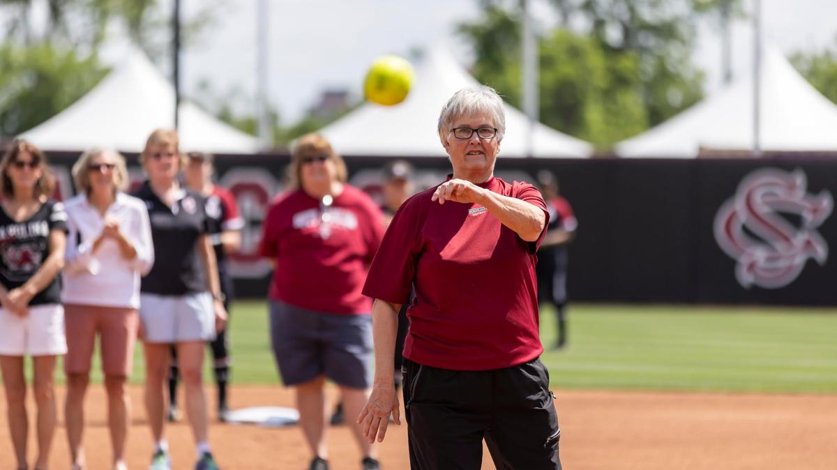 Retired Lady Gamecocks Softball Coach Joyce Compton throws out the first pitch of the Lady Gamecocks??? game against Ole Miss following her jersey retirement ceremony held at Carolina Stadium at Beckham Field on Saturday, April 13, 2022.