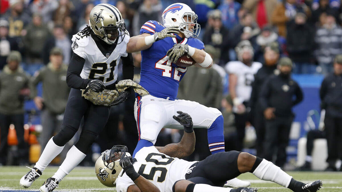 Nov 12, 2017; Orchard Park, NY, USA; Buffalo Bills fullback Patrick DiMarco (42) makes a catch and is tackled by New Orleans Saints cornerback De’Vante Harris (21) during the second half at New Era Field. Mandatory Credit: Timothy T. Ludwig-USA TODAY Sports